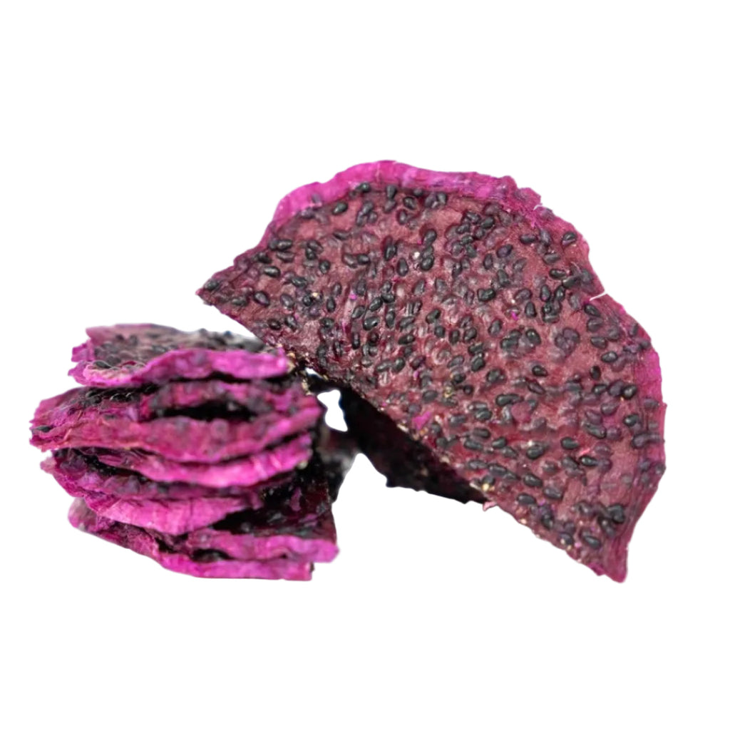 Close-up of dehydrated red dragon fruit halves used as cocktail garnish